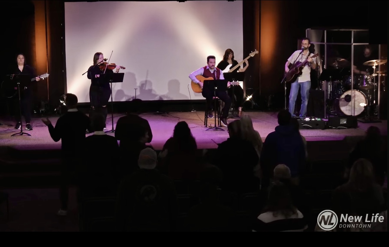 Bobby Azad serving on the worship team at New Life Fellowship Church